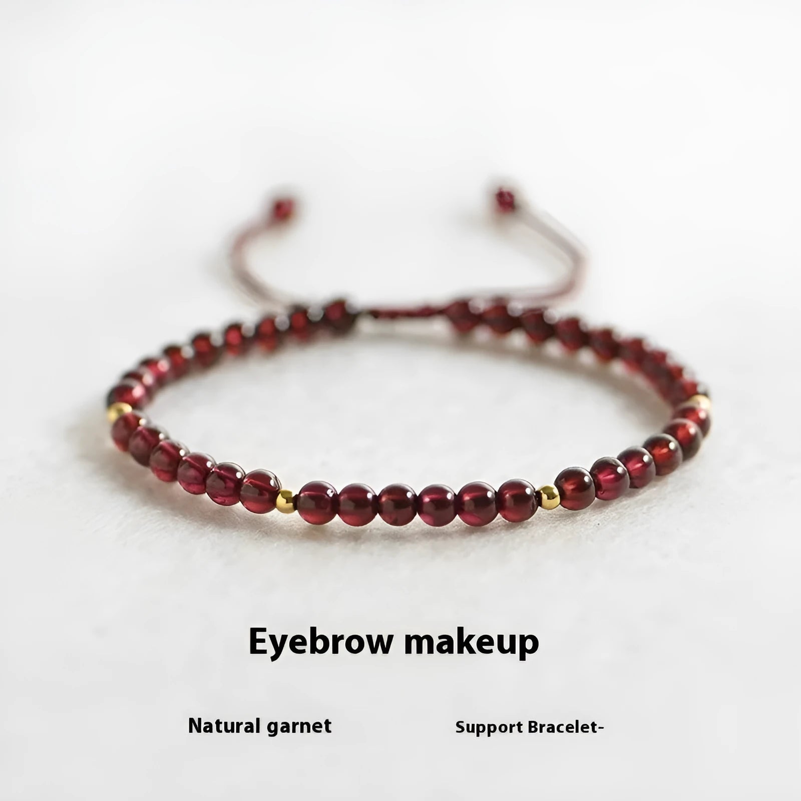 Hand-woven garnet red rope bracelet with flexible wire on a neutral background.