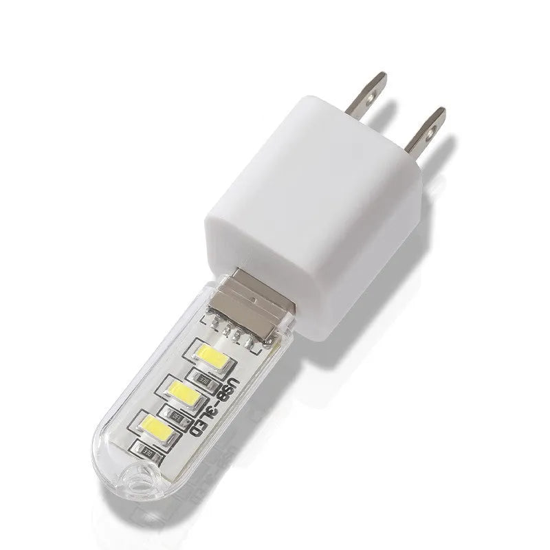 Compact white baby night light with USB cable showing dual colour options for nursery use