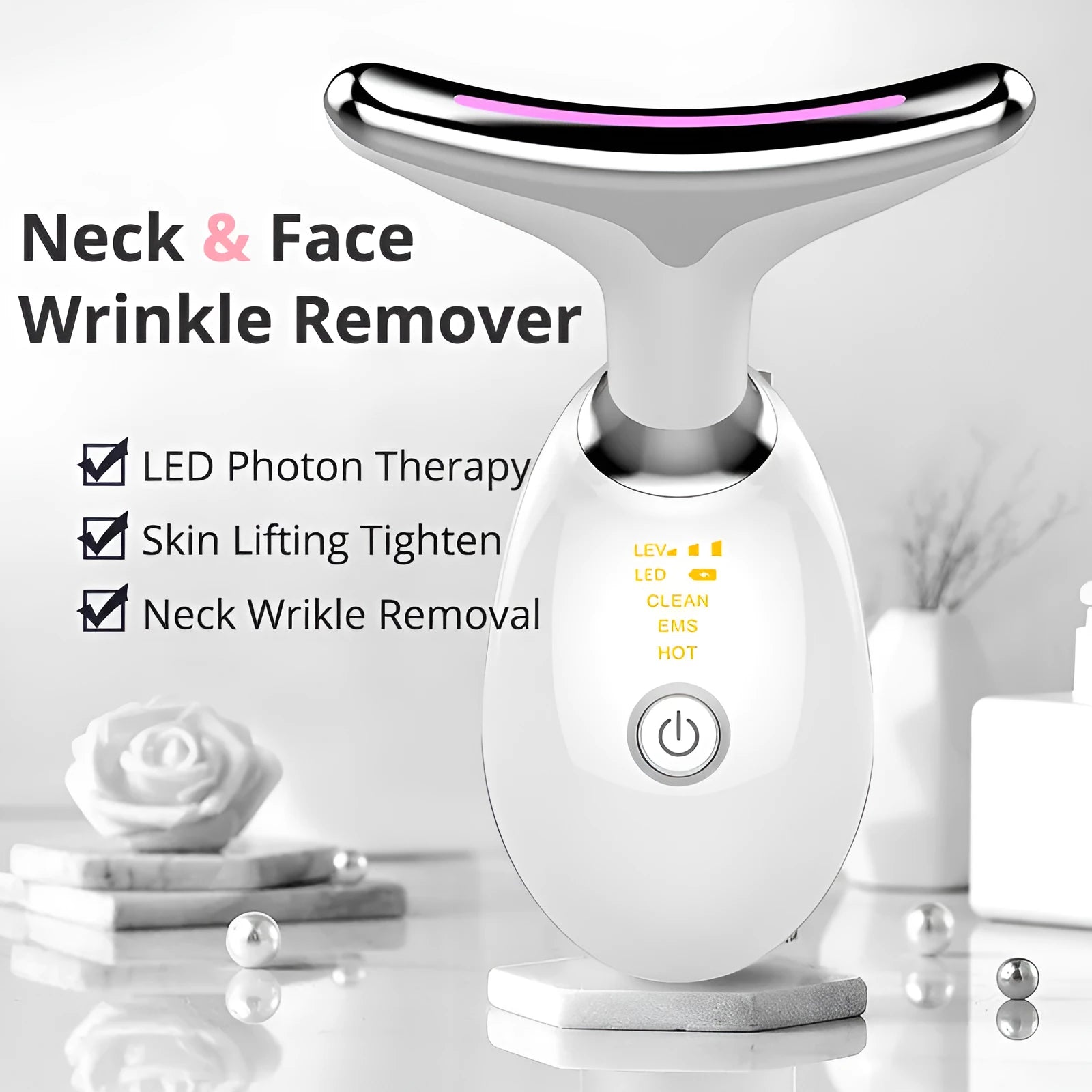 White EMS thermal neck lifting massager device with LED lights shown with USB cable and moisturiser.