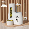 White, blue, and pink automatic hamster water feeder with attached food basin.