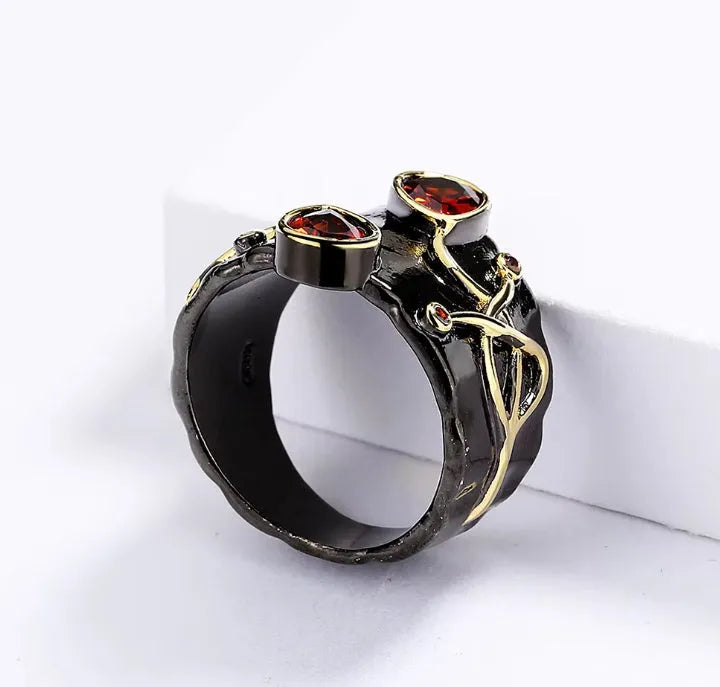 Retro women's brass oval ring in black finish on white background
