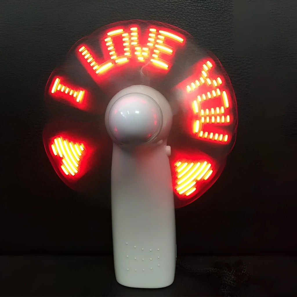 White handheld mini fan with blue and red LED love pattern flashing on its front