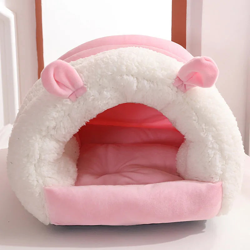 Closed cat nest bed in blue colour with removable cushion shown in home setting