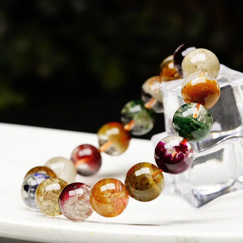 Crystal bracelet with 10mm beads showing colourful four seasons stones in ghost cornucopia ethnic design