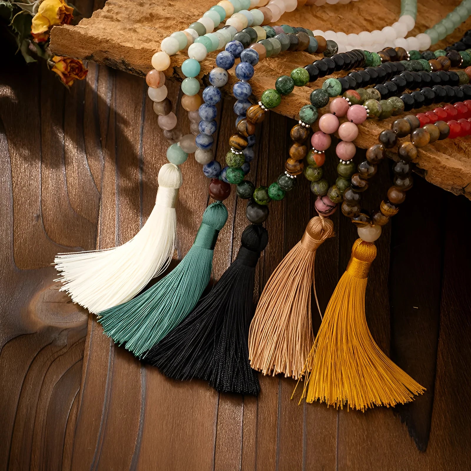 Vintage bohemian long necklace with tassel and stone beading alongside matching bracelet in geometric ball bead design