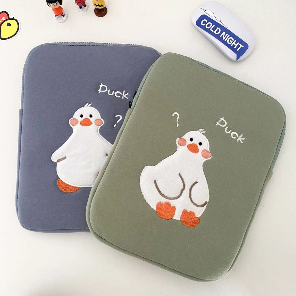 Blue cotton iPad case with embroidered cartoon duck design and a zipper.