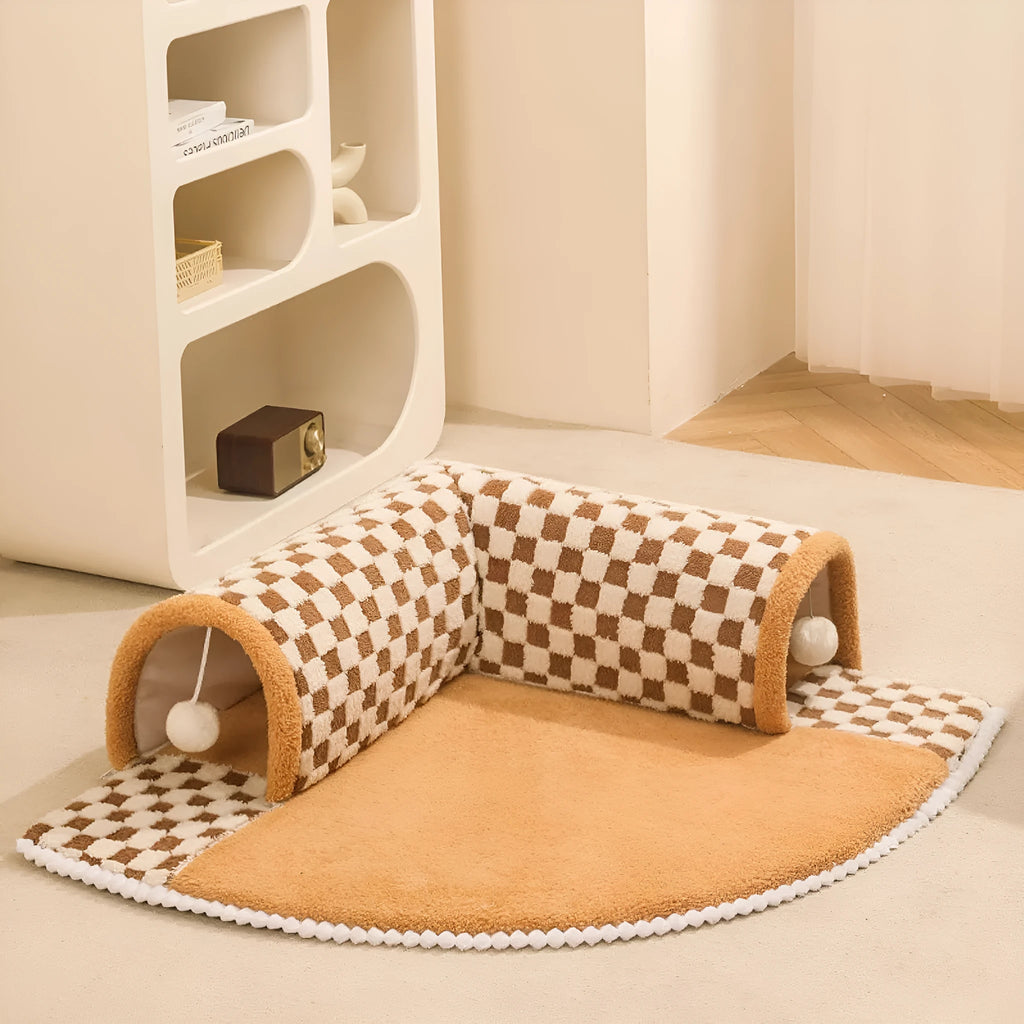 XL sized fan-shaped plush pet bed with an attached tunnel in coffee colour on a wooden floor.