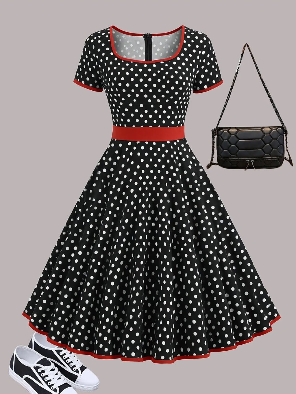 A women's polka dot pleated dress with a square collar and zip closure.