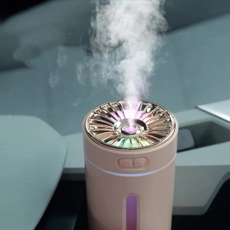 Black portable USB rechargeable humidifier with colourful LED lights on a car cup holder