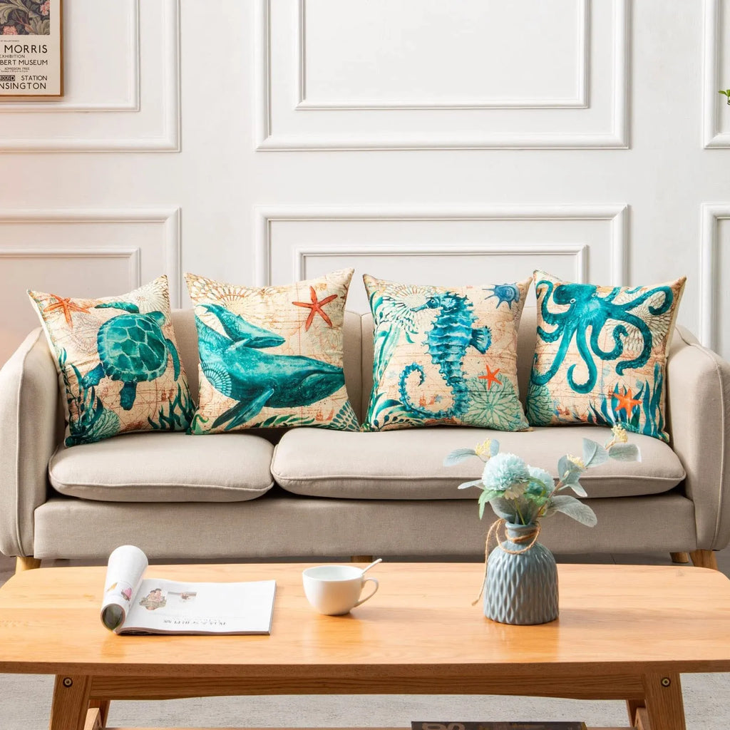 Square linen cushion cover with a detailed blue sea turtle print, showing a hidden zipper along one edge.