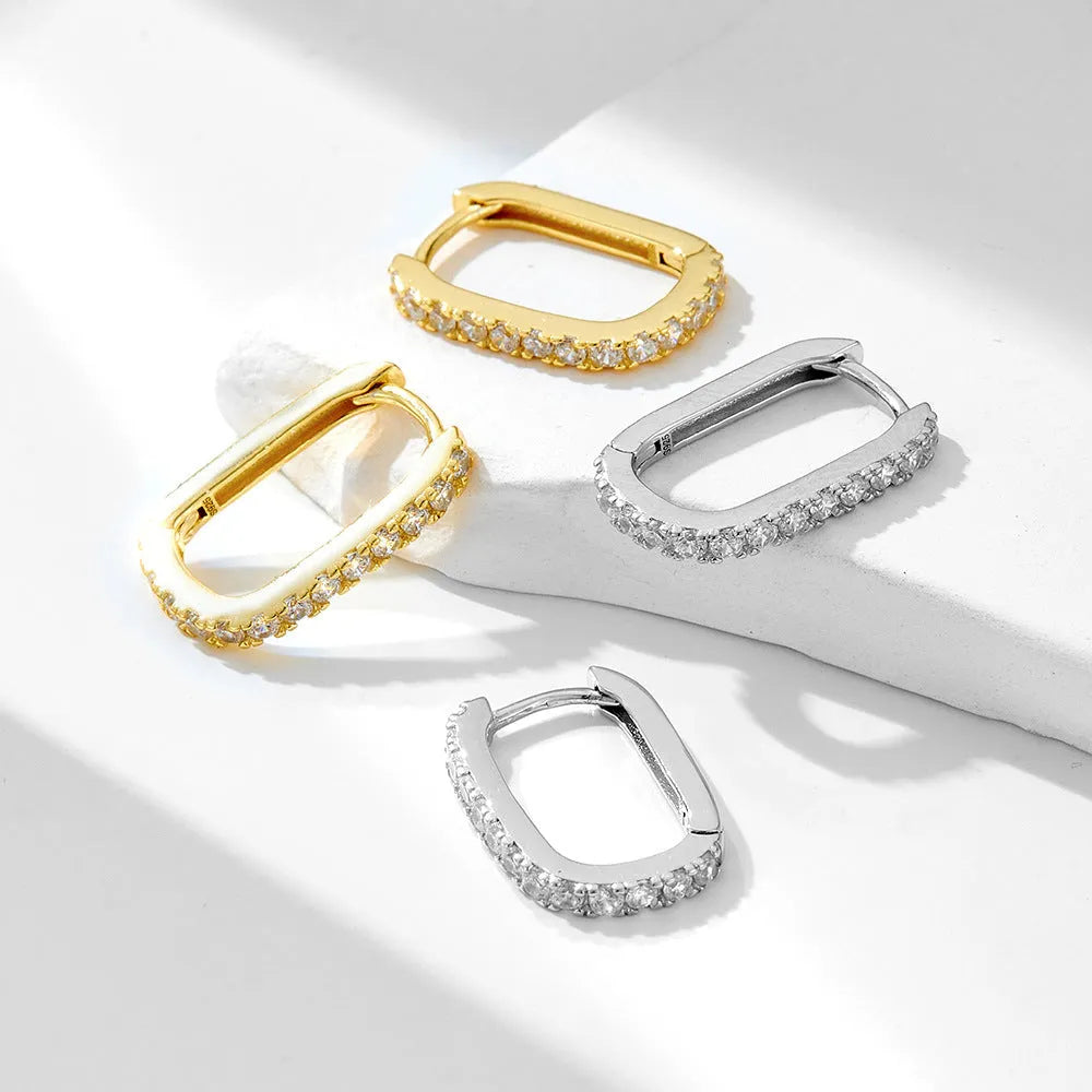 S925 Sterling Silver geometric oval zircon stud ear clips for women in white and yellow.