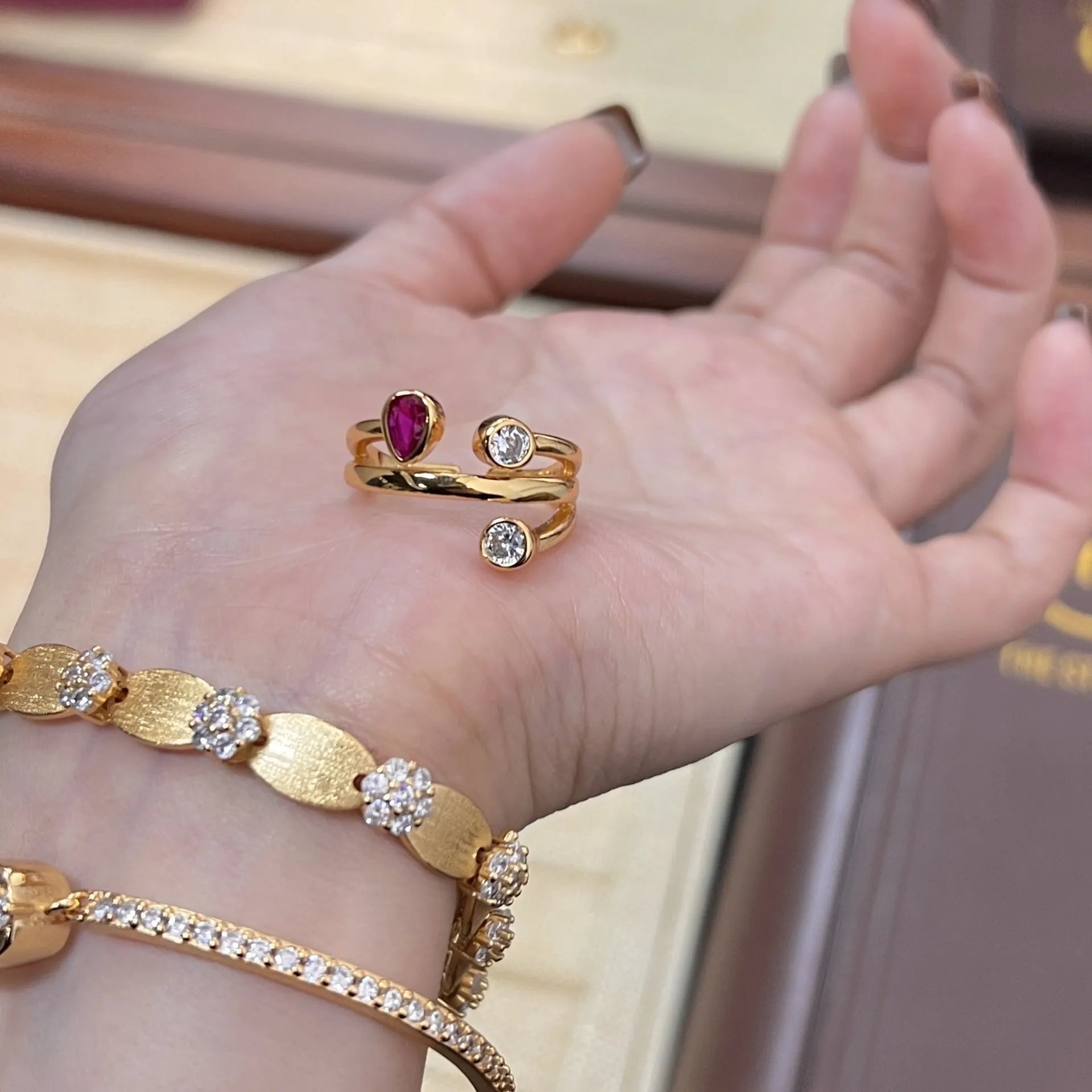 Geometric retro-style ring with an irregular cross design set with diamonds, in two-tone colours.