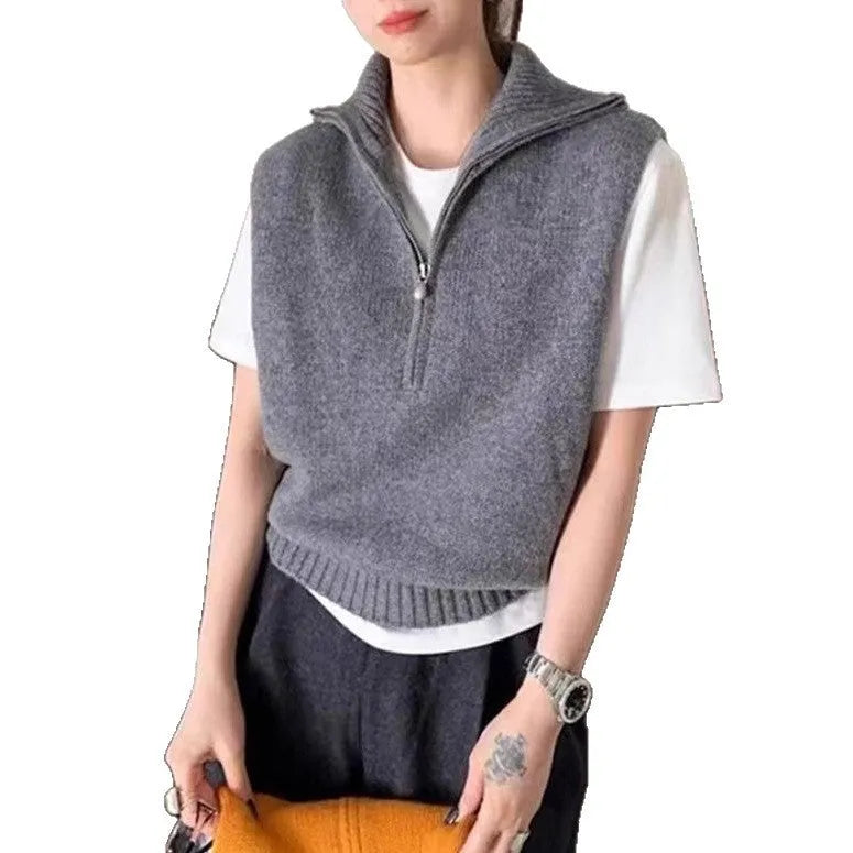 Retro half zip sleeveless knit vest in mesh polyester, shown in orange colour with 3D pattern detail.