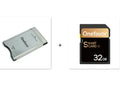 SD to PCMCIA adapter card with stainless steel housing and inserted 32GB SD card for Mercedes-Benz cars.