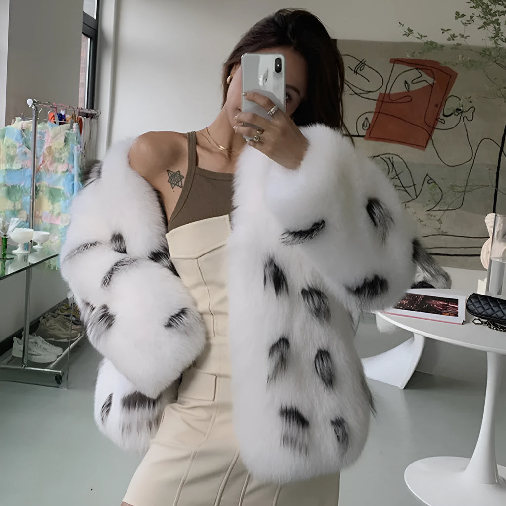 Black and white short faux fur coat with regular sleeves on a model, showing Korean slim-fit style.