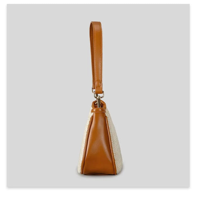 Khaki hand-woven straw crossbody bag with a single strap and contrasting detail.
