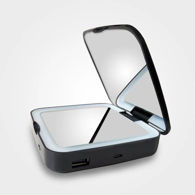 Black and white makeup mirror with dual reflection surfaces and adjustable lighting controls