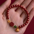 Emperor sandstone Fu character bracelet with happy eyebrow pattern in 6mm or 8mm cinnabar bead sizes
