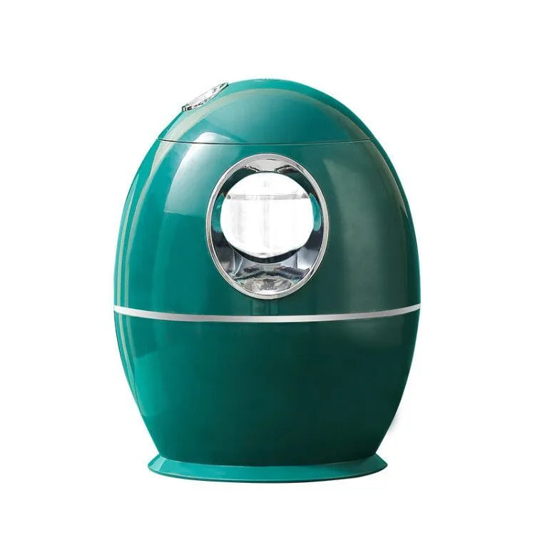 Compact round white USB desktop humidifier and aromatherapy diffuser on a wooden table.