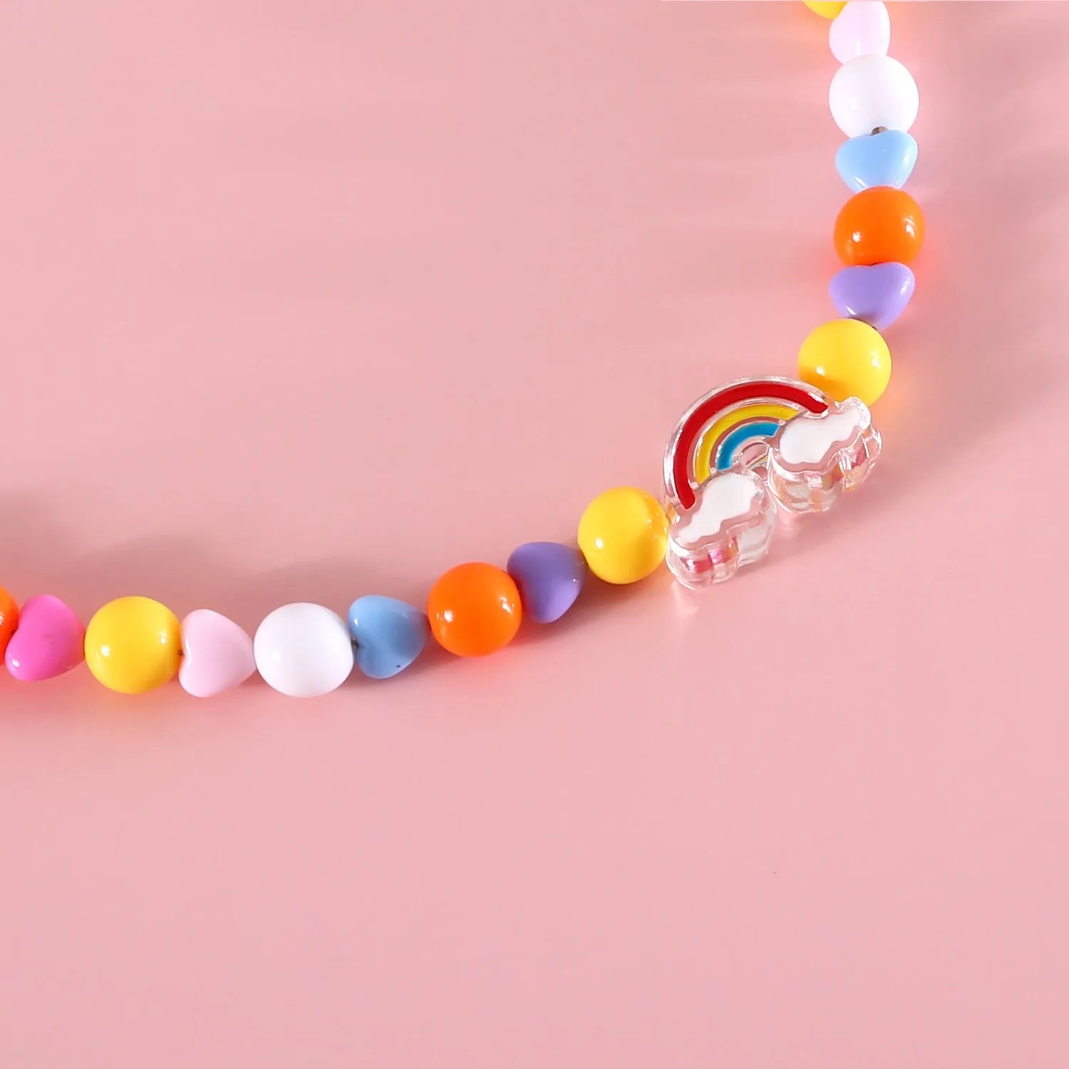 Colourful pearl bead pet necklace in small flower, rainbow, or peach designs with adjustable sizing for cats and small dogs.