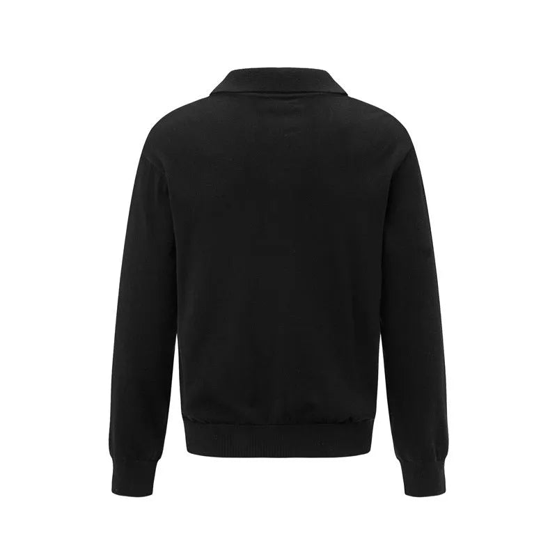 Loose black pullover sweater on a hanger, showing casual fit