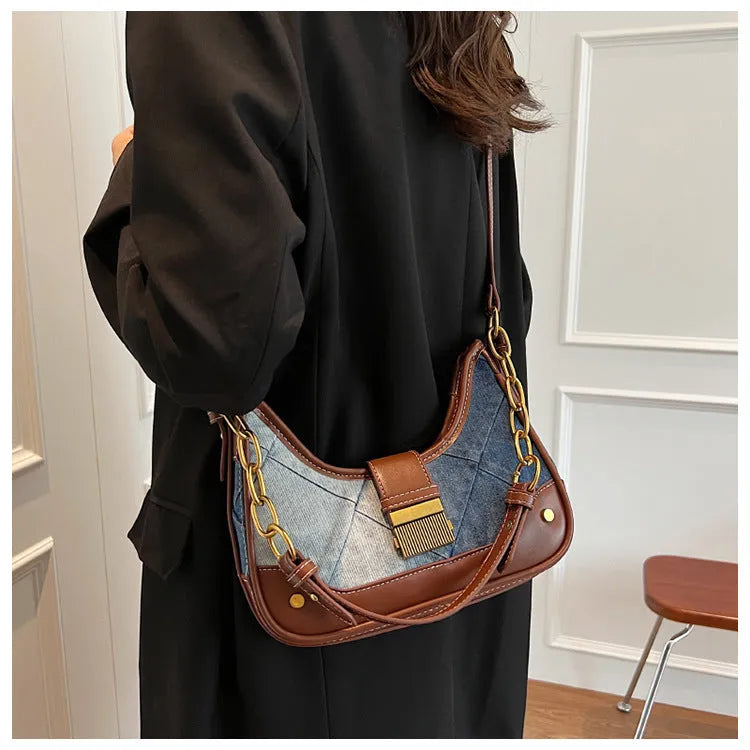 Brown denim women's bucket shoulder bag with diamond mesh panels and chain straps