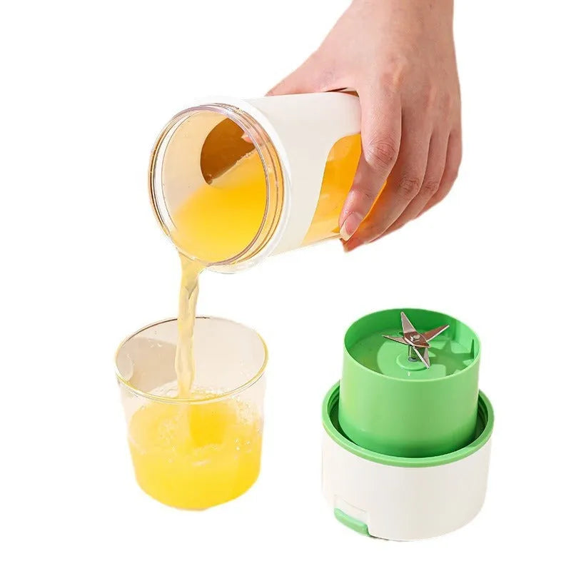 Blue portable USB electric juicer blender with 400ml clear plastic cup on a table
