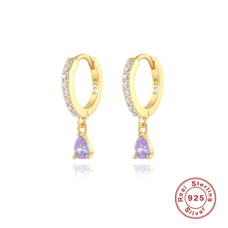 Geometric water drop sterling silver earring with a crystal stone in a gold tone setting.
