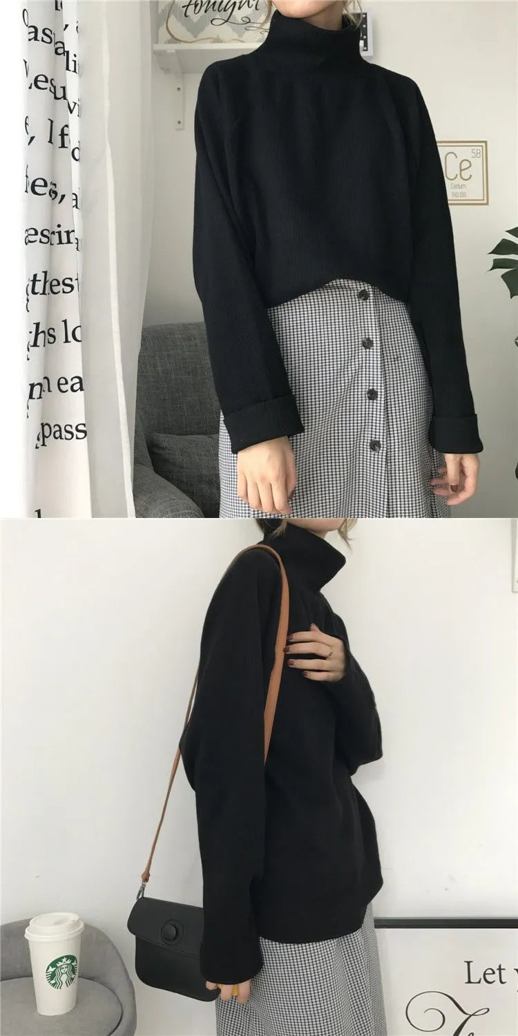 Women's loose half-high collar long sleeve top in solid apricot colour on a hanger.