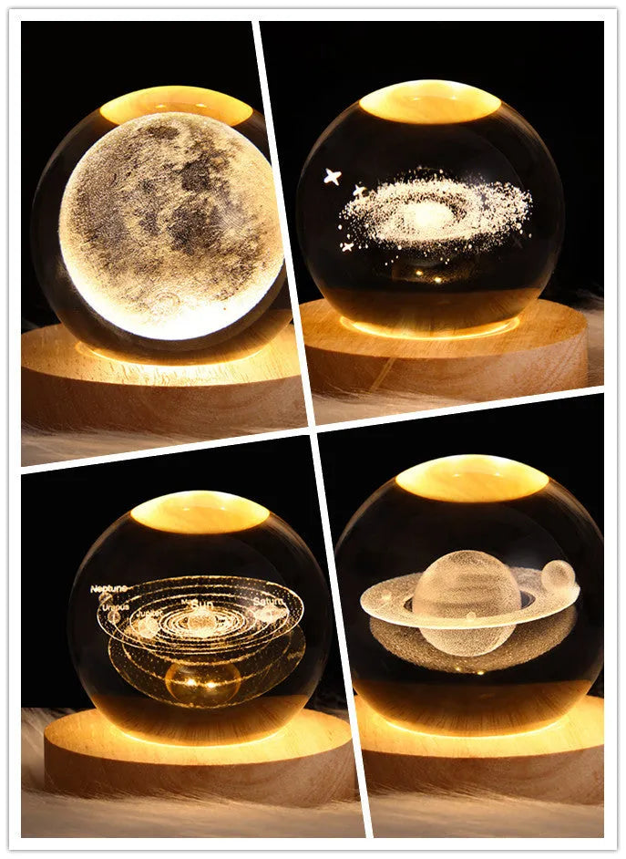 LED galaxy crystal ball night light with 3D planet designs on a table