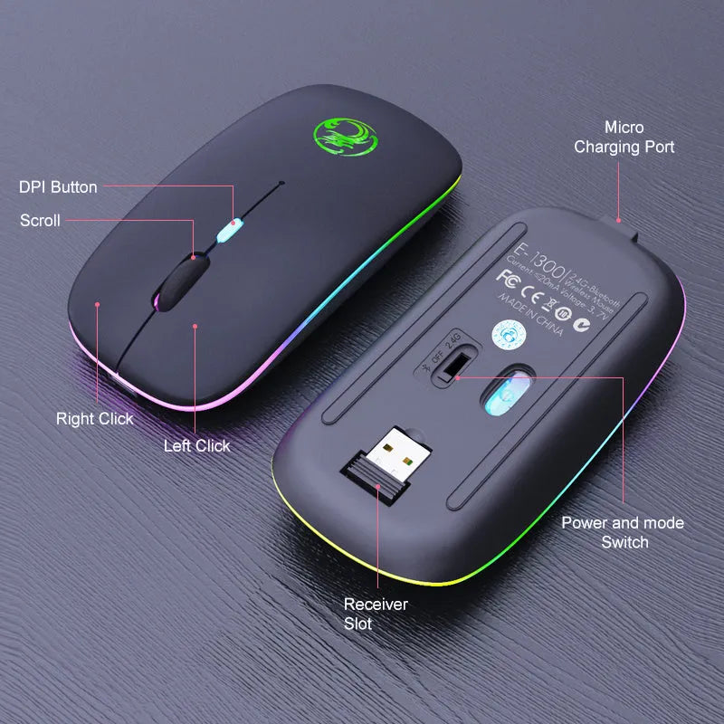 Black and white dual-mode wireless silent mouse with USB charging cable on a desk.
