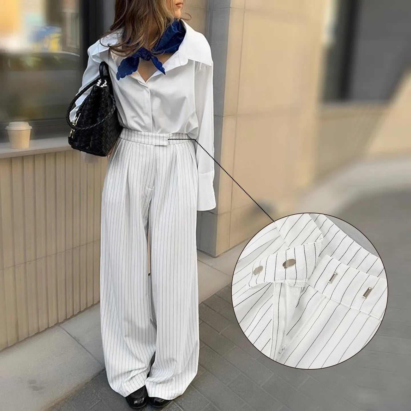 White striped loose fit wide-leg casual trousers with a zipper, shown on a hanger.