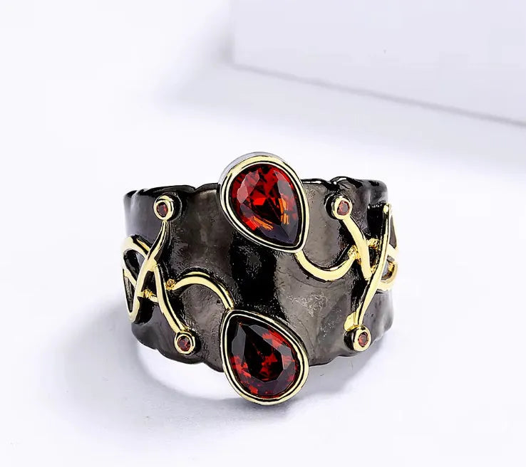Retro women's brass oval ring in black finish on white background