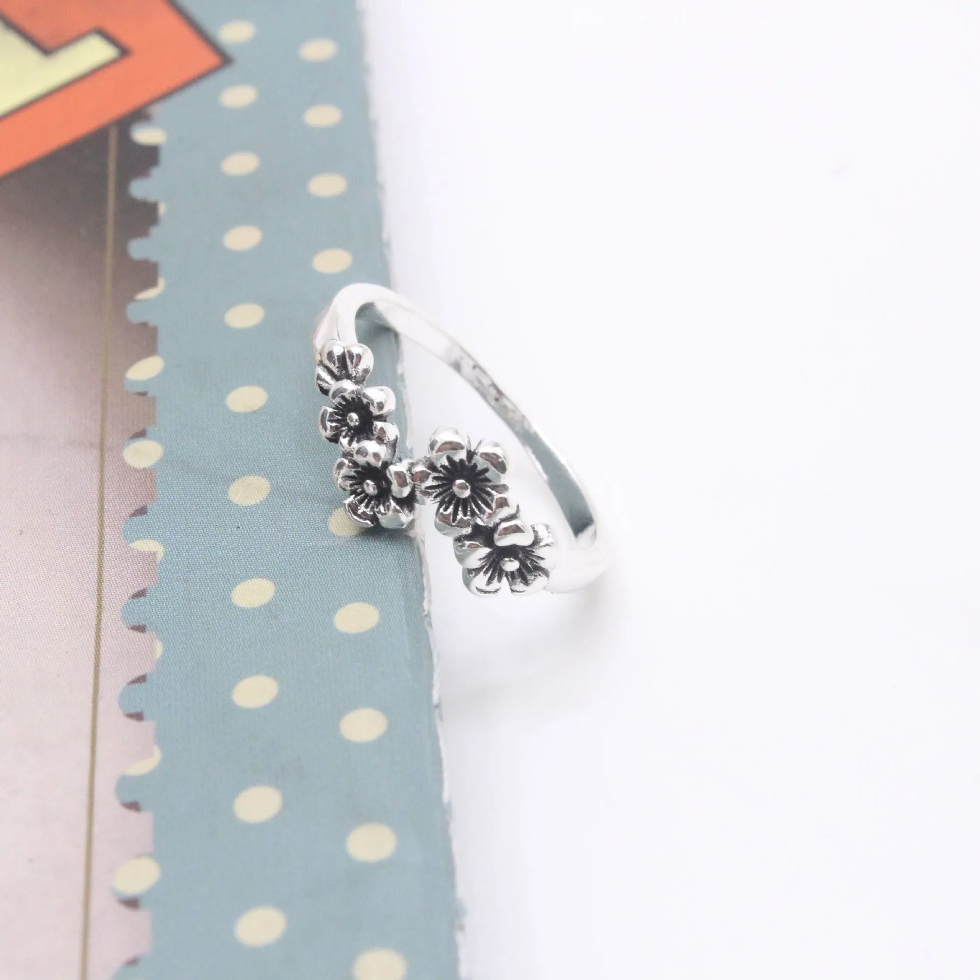 Antique silver alloy geometric ring with retro personality style on white background