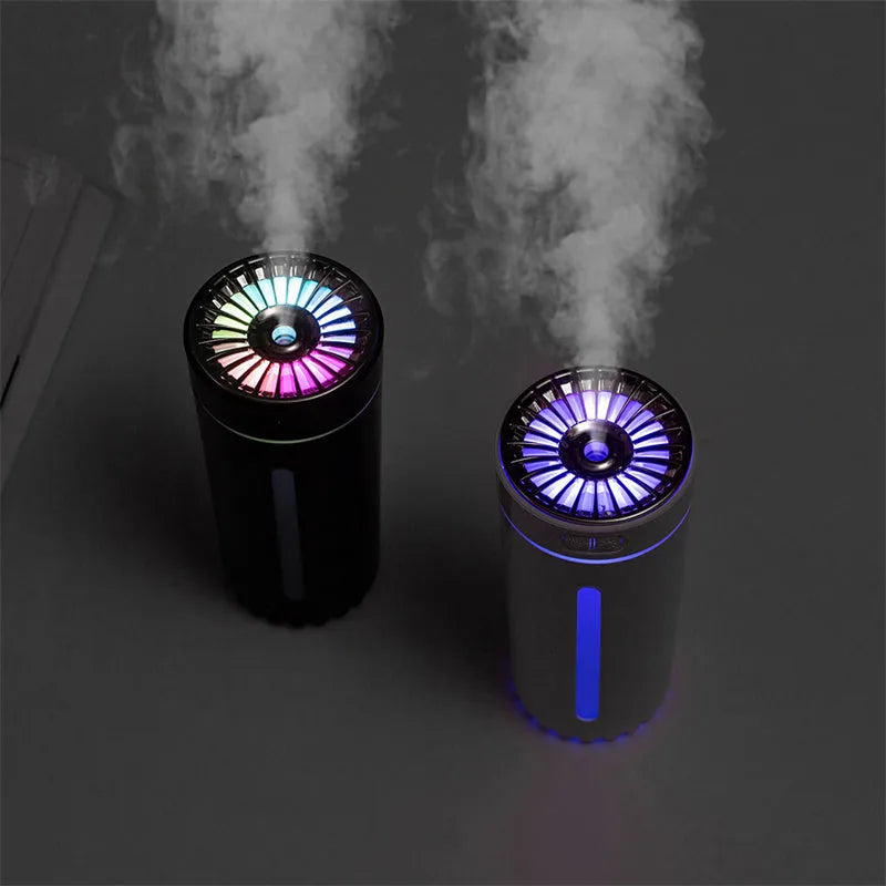 Black portable USB rechargeable humidifier with colourful LED lights on a car cup holder