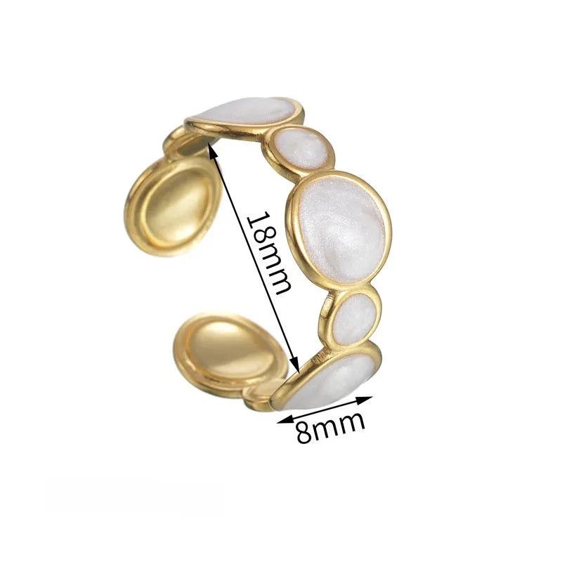 Adjustable stainless steel ring with a geometric shape and electroplated metallic finish.