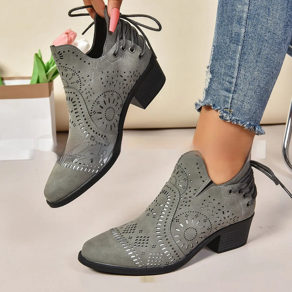 Women's plus size mid-calf ankle boot in artificial PU material, shown in black colour.
