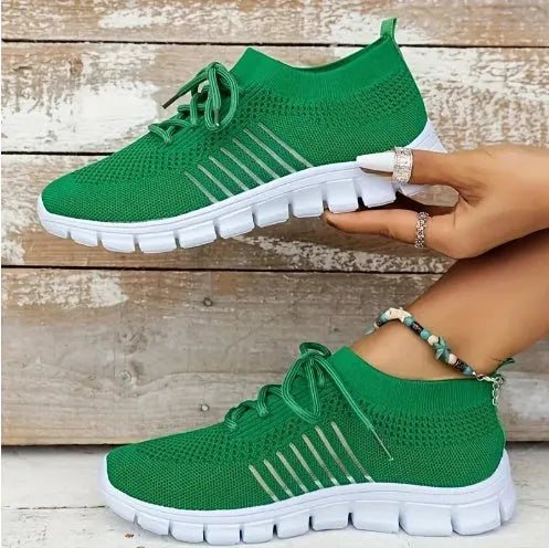 Women's high-top breathable sneaker in multiple colours on a white background, showing lace-up front and flat rubber sole.