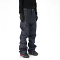 A pair of dark blue loose straight-cut jeans laid flat, showing the front design.