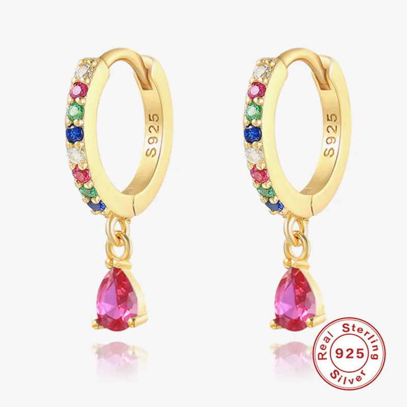 Geometric water drop sterling silver earring with a crystal stone in a gold tone setting.