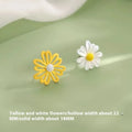 Close-up of colourful cartoon flower stud earrings in alloy on a white background.