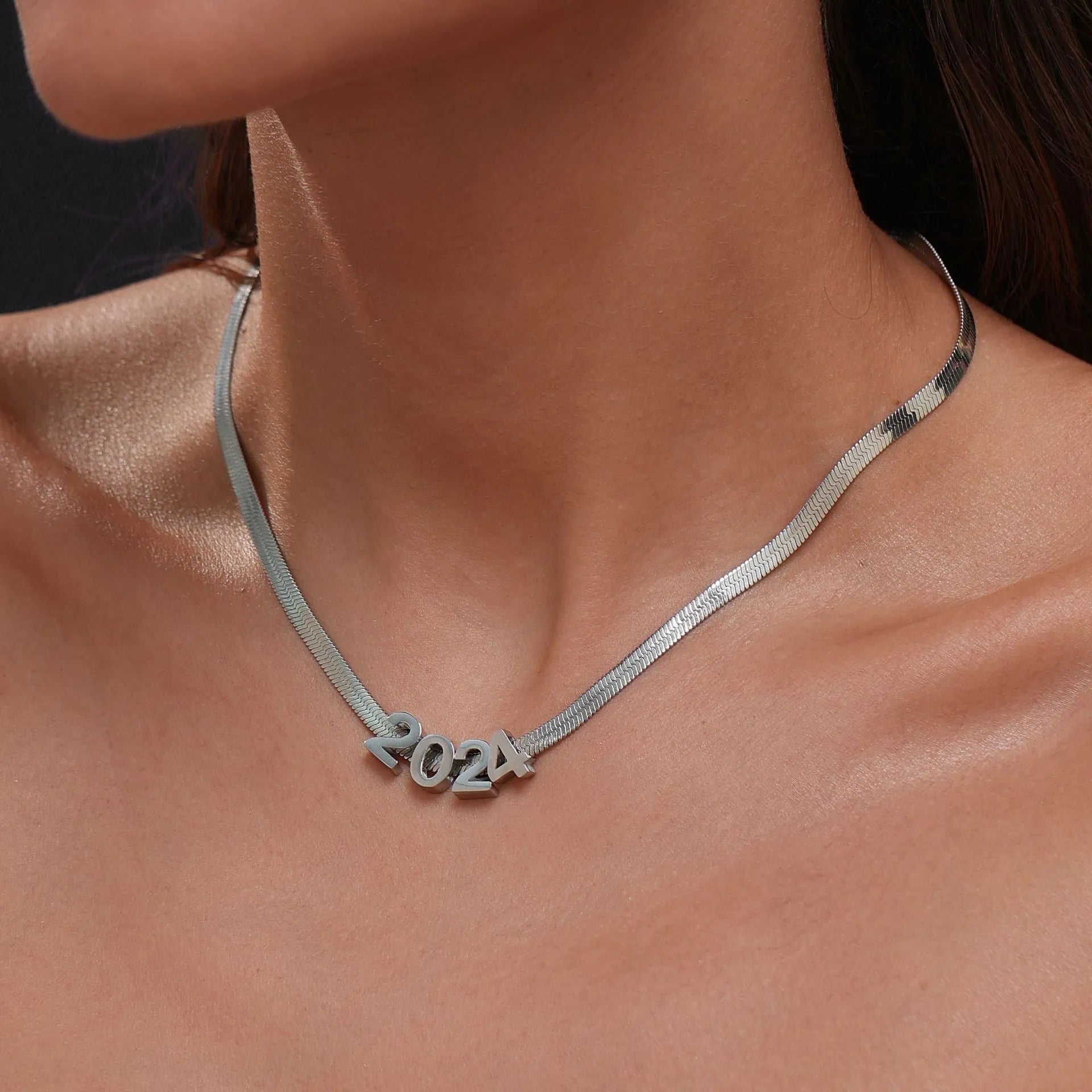 Personalised titanium steel necklace with a single letter A charm on a 40 cm gold chain.