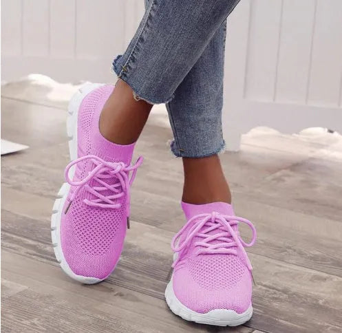 Women's high-top breathable sneaker in multiple colours on a white background, showing lace-up front and flat rubber sole.