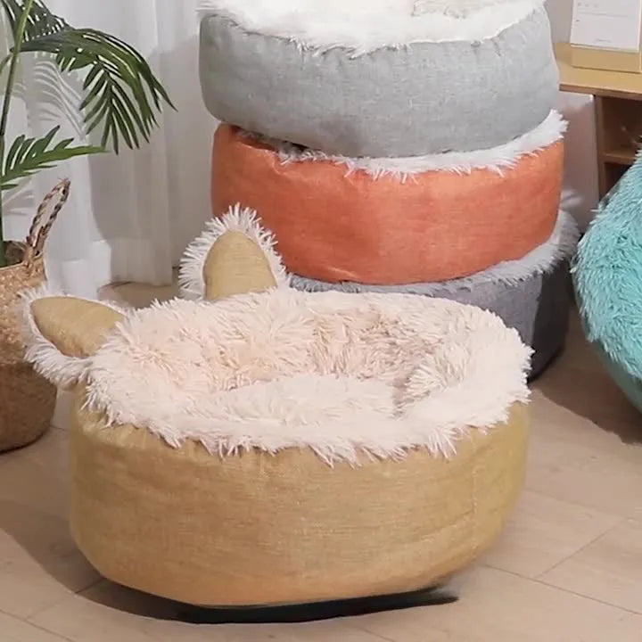 Soft faux fur plush cat bed in grey with fluffy interior – available in multiple sizes and colours for indoor use