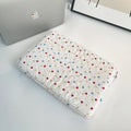 Women's polka dot polyester laptop bag shown in solid colour with size options for 11-inch to 15.6-inch laptops.