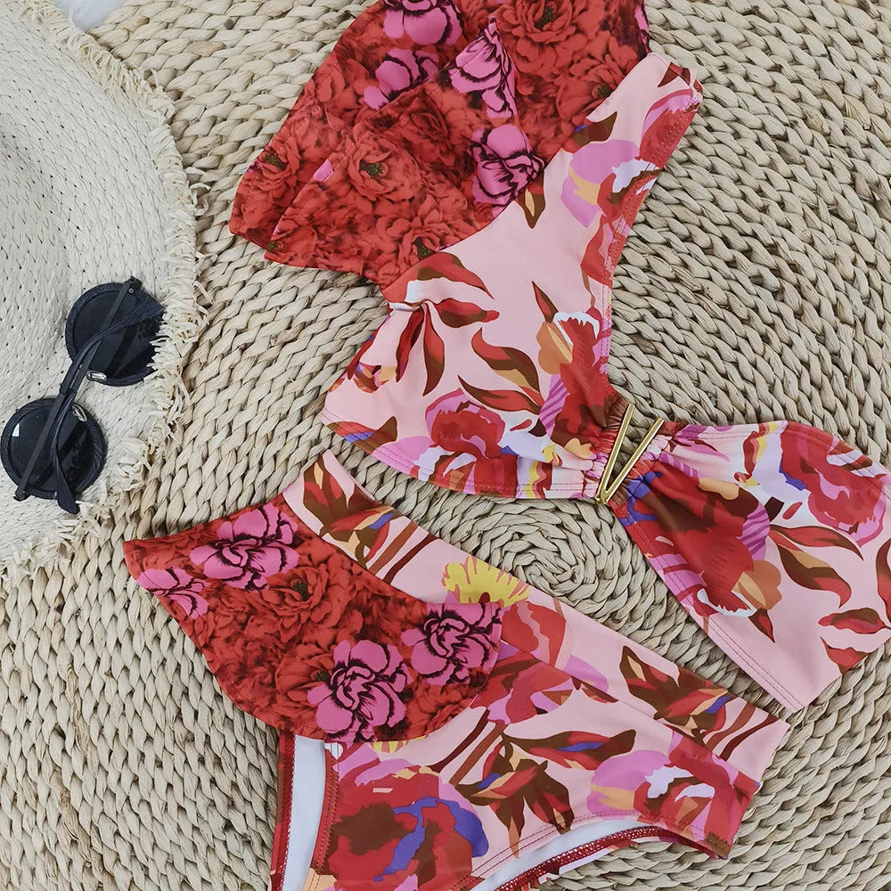 Women's pink floral print one-shoulder bikini with ruffled detailing and high-waist briefs