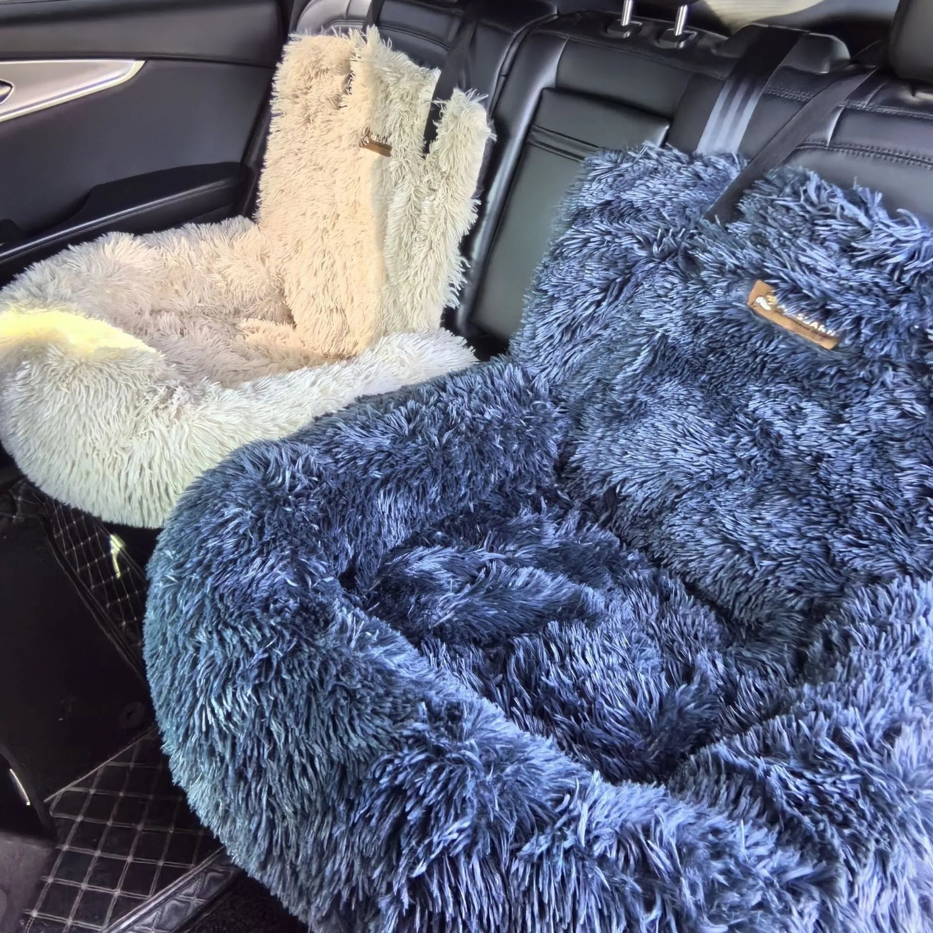 Beige cloth pet mat lying flat on a car seat, shown next to a dark grey version.