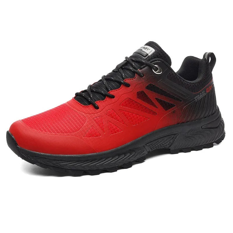 Men's black and orange breathable mesh running shoe with lace-up front on a flat heel.