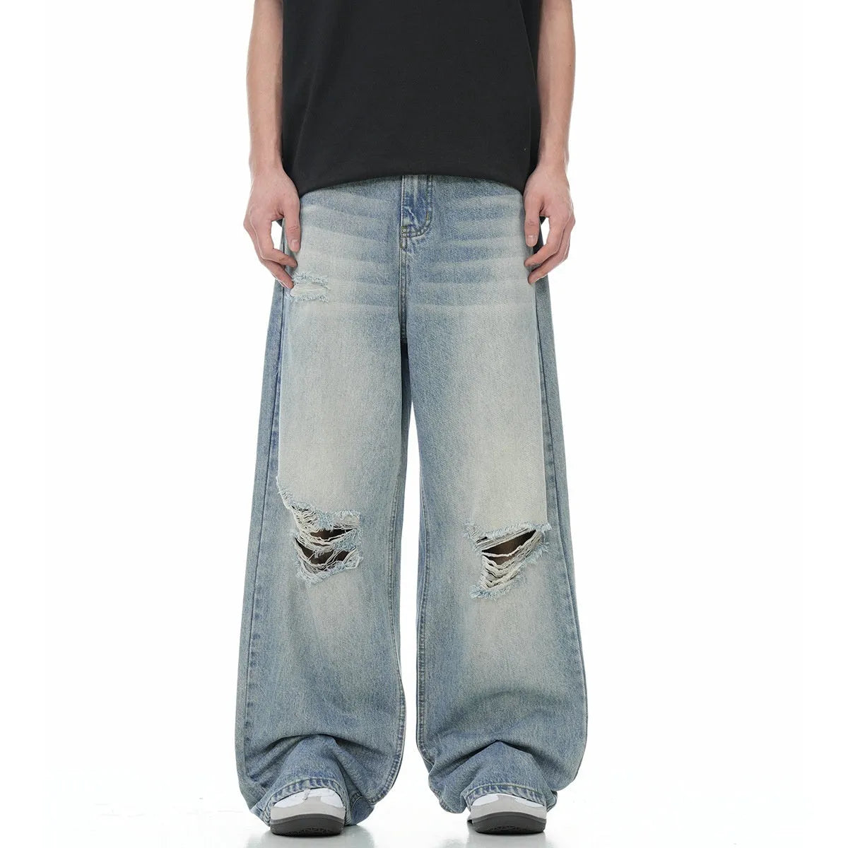 Blue straight-leg jeans with ripped detailing on cotton blend fabric