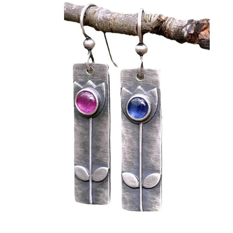 Antique finish red sapphire earrings with geometric ellipse design on electroplated metal